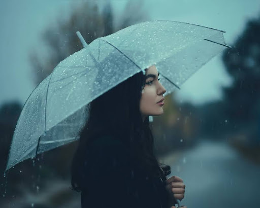 Woman holding an umbrella on a rainy day