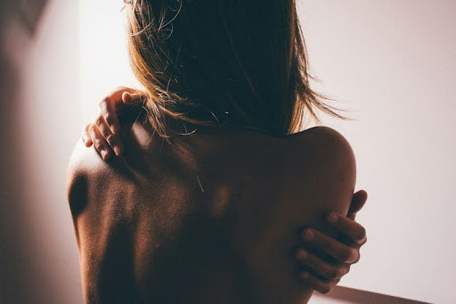 Close-up of a woman’s back in soft lighting