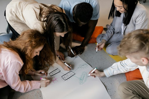 Young adults brainstorming a startup idea together.