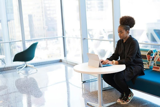 Woman working on a laptop in a modern office