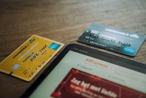Visa credit card on a brown wooden table