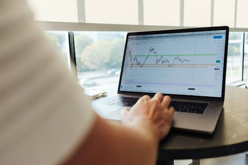 Person researching investment strategies on a laptop