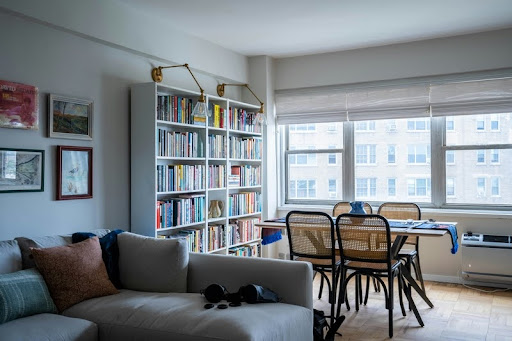 Spacious modern living room with natural light and neutral décor