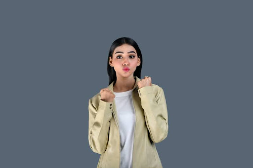 Woman in a suit standing confidently