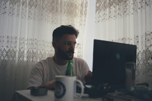 Man working from home on a laptop at a desk