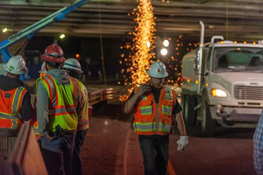 Workers performing night shift duties under artificial lighting