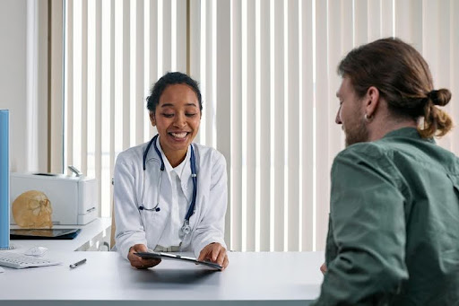 Man speaking with a doctor in a medical office