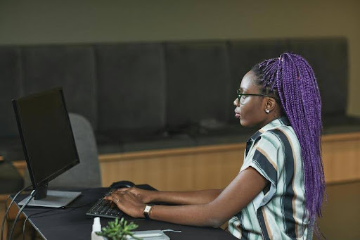 Woman working on a laptop at a desk