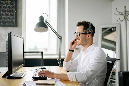 Employee using a computer at a desk