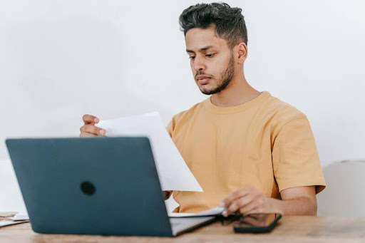 Man using a laptop at a desk