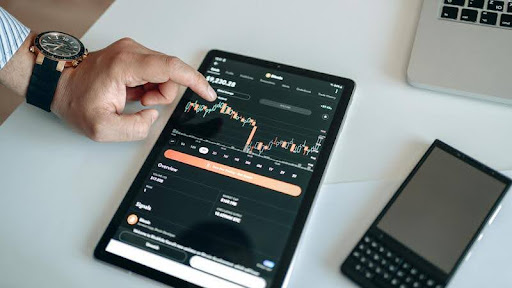 Tablet displaying cryptocurrency data and analytics.