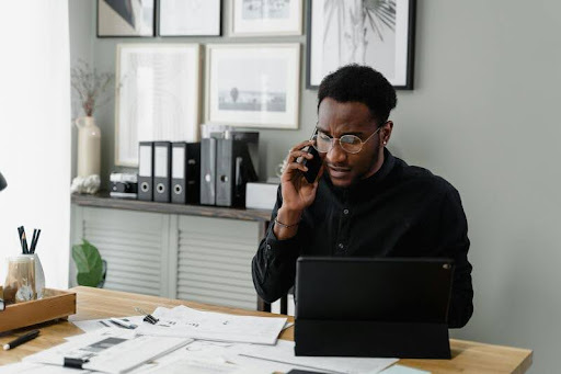 Man using a laptop at a desk