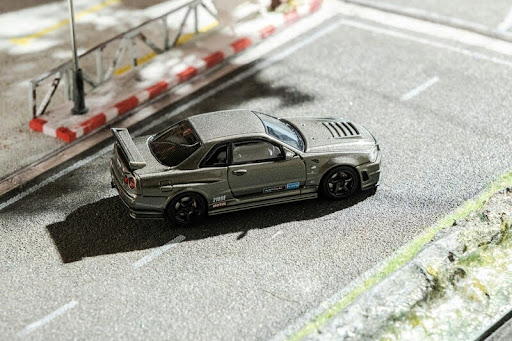 Racing car parked on a road under daylight