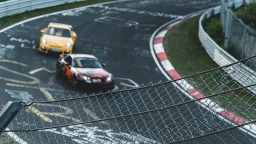 Racing cars speeding on a track during a motorsport event