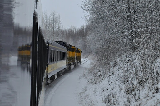 Train passing through a scenic countryside area