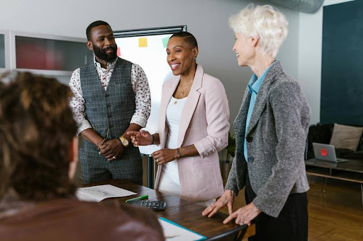 Employees gathered around a table in a business meeting