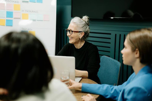Group of people in a meeting around a conference table