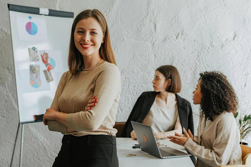 Employees listening to a presentation in a modern office setting