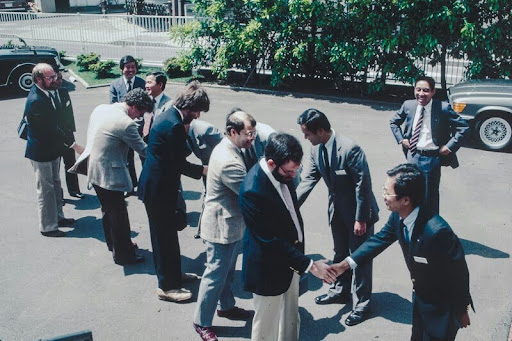 Group of professionals seated around a conference table during a team meeting