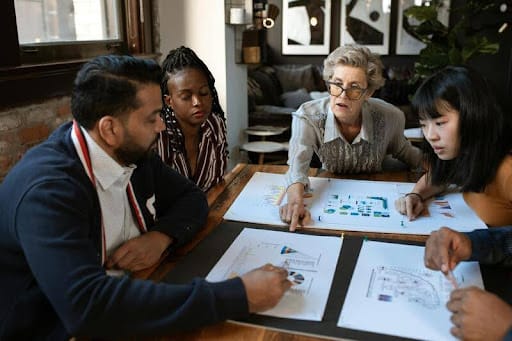 Group of diverse professionals having a business meeting around a table