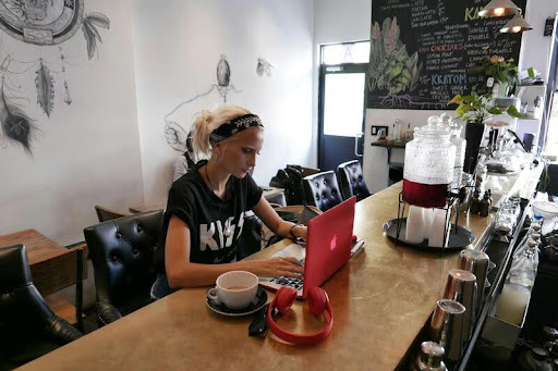 Woman working on her laptop at a desk