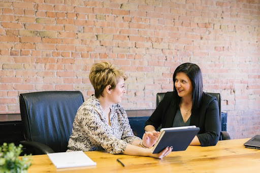 Woman sitting in a job interview, attentively listening