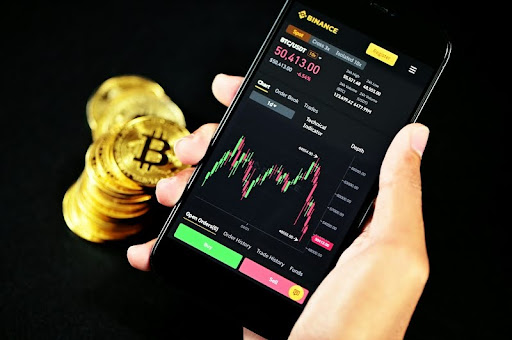 Trader analyzing crypto charts on Binance trading platform