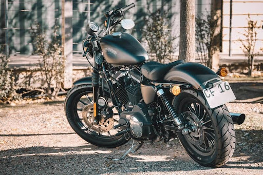 Parked used motorcycle on a paved lot