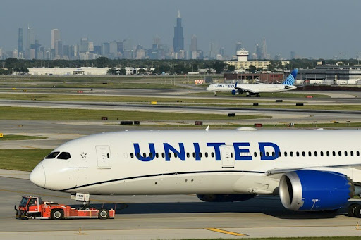 United Airlines plane on a runway preparing for takeoff