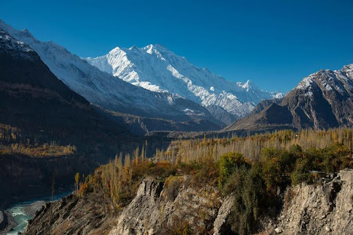 Scenic view of a mountain valley with vibrant fall foliage