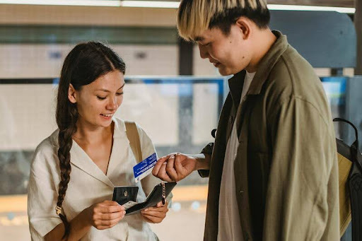 Couple using a credit card to purchase travel tickets