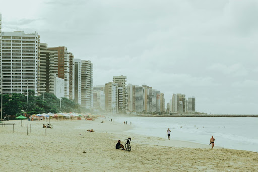 City skyline along a beach with clear blue water