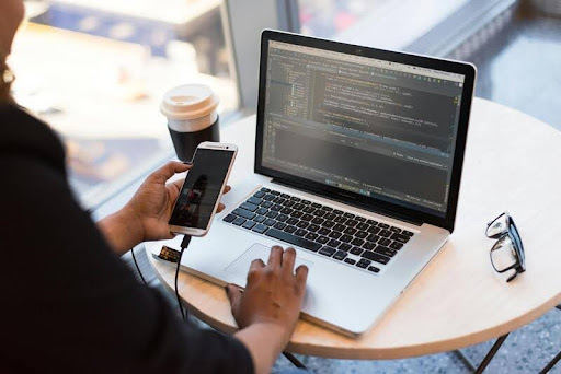 Man using a laptop at a desk