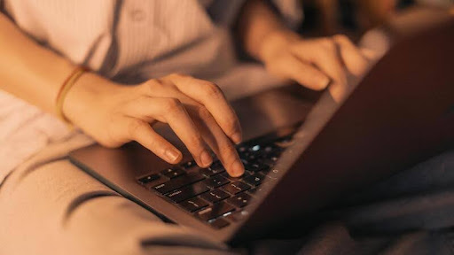 Person using a laptop at a desk