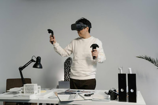 Man wearing a VR headset while working at a desk