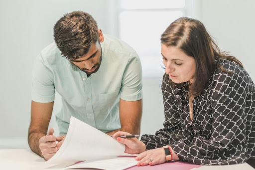 Woman reviewing a financial document at home