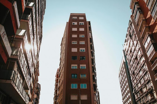Low-angle view of tall commercial buildings against the sky