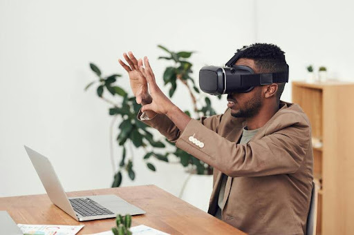 Man wearing a VR headset while interacting in a digital environment