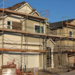 Row of partially built houses at a residential construction site