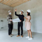 People inspecting a new construction site for quality and safety