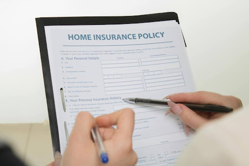 Home insurance policy document on a wooden desk