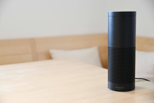 Amazon Echo smart speaker on a wooden table