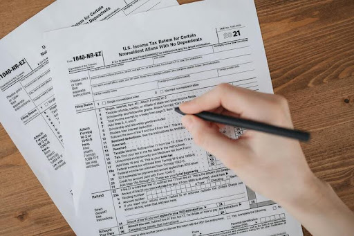 Woman filling out a form at a desk