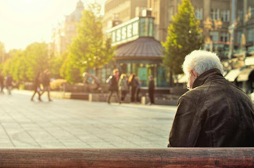 Elderly man sitting calmly in a chair