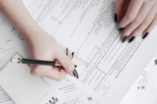 Woman filling out a tax form at her desk