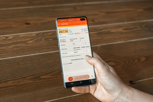 Person checking stock updates on a smartphone