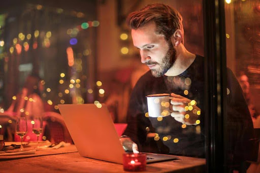 Man using a laptop at a desk