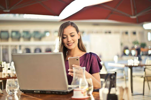 Woman using a laptop in a modern office setting