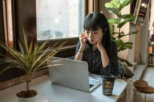 Woman using a laptop at a desk