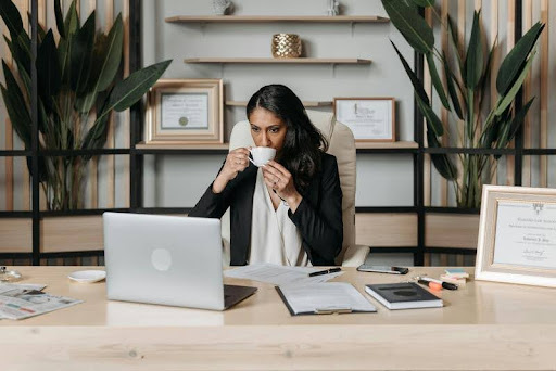 Woman using a laptop at a desk